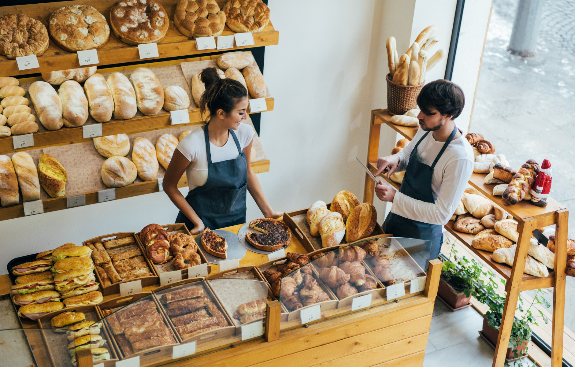 Business owner and employee in a working in a bakery